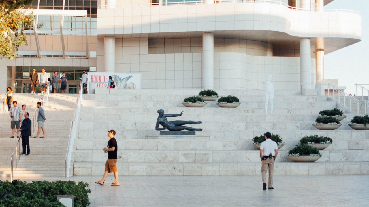 The steps leading up to the Getty Museum in Los Angeles, with guests and a security person visible.
