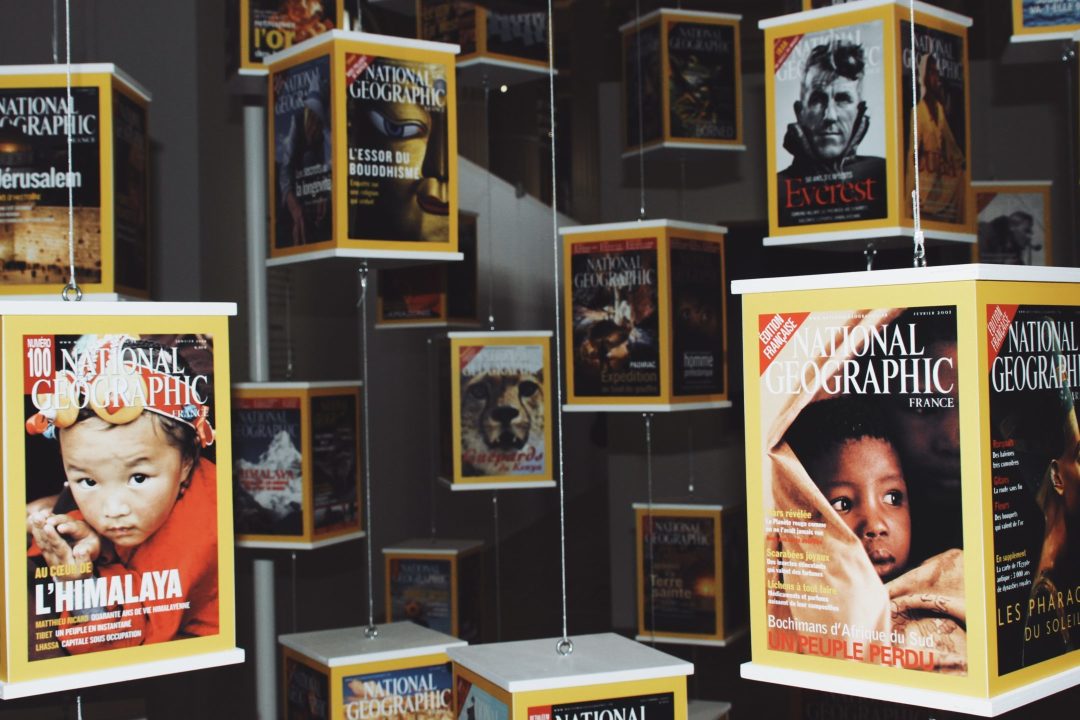 A display of issues of National Geographic magazine in a museum