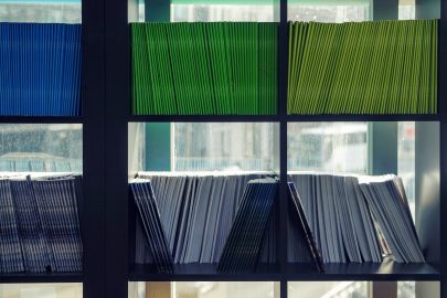 Shelves filled with color-coded document folders