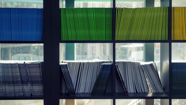 Shelves filled with color-coded document folders