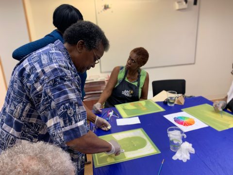 A group of people creating portraits from photographs