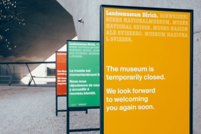 Signage in a museum reading "The museum is temporarily closed. We look forward to welcoming you again soon."