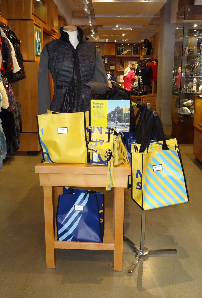 A table displaying colorful reusable bags