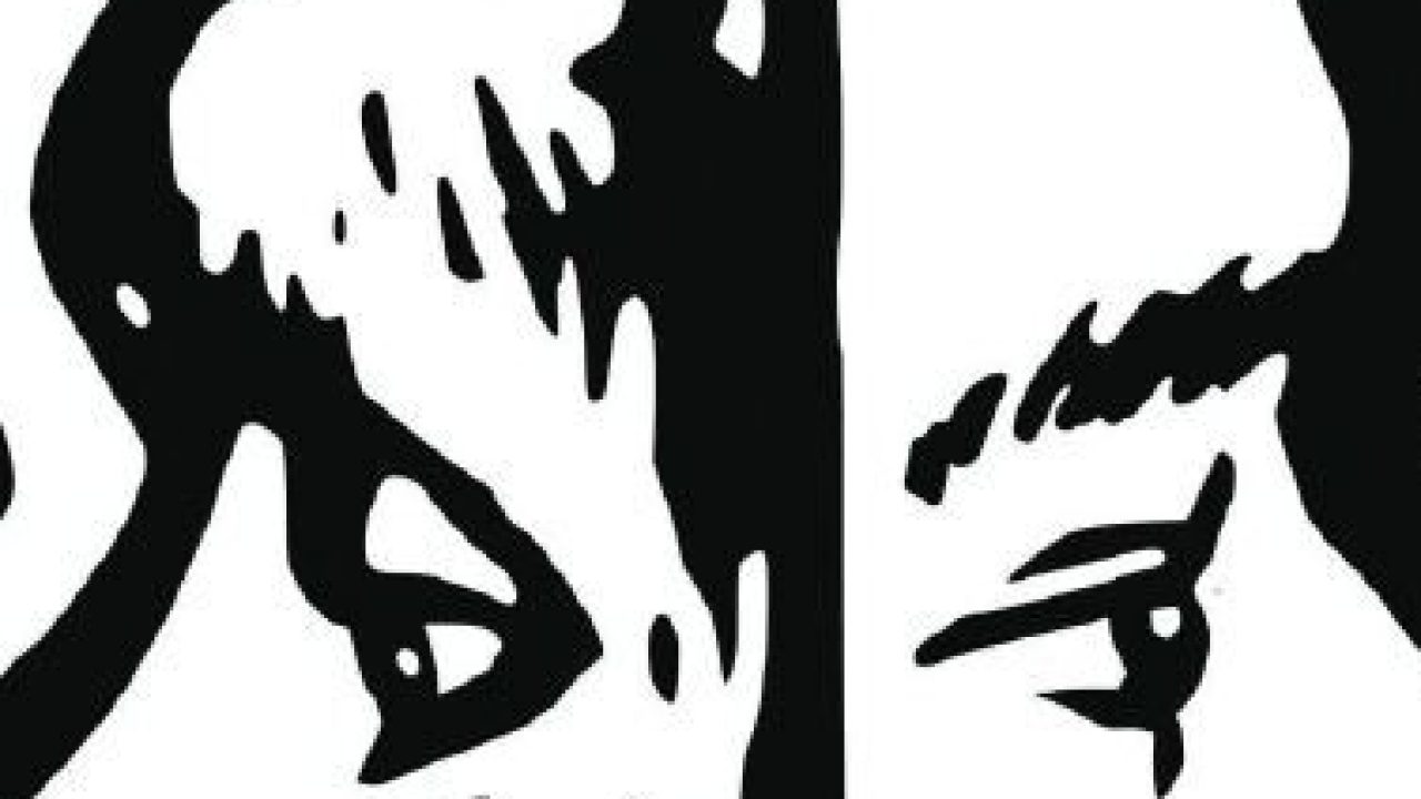 A graphic of two faces in black outlines on a white background facing away from each other