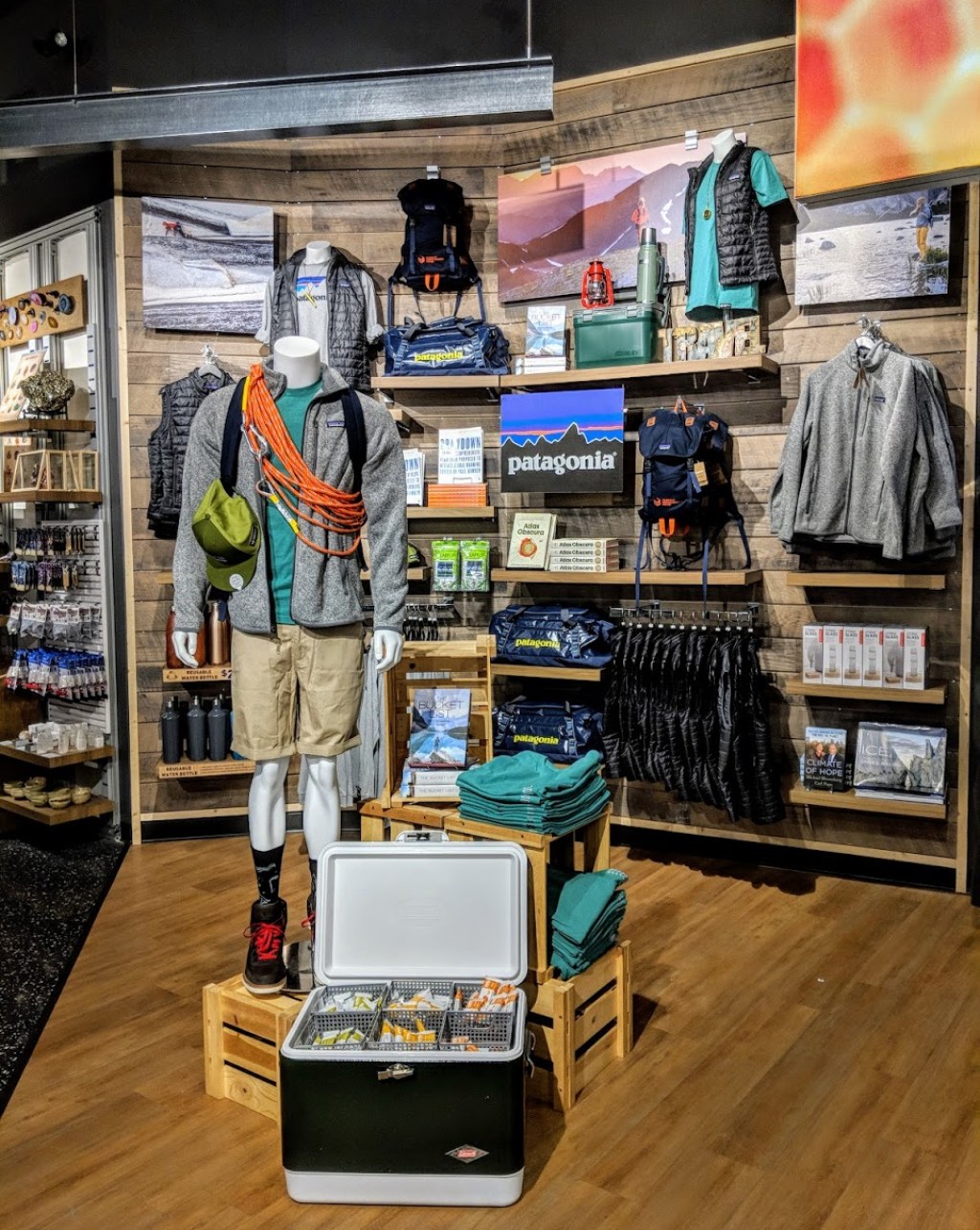 A display of Patagonia clothing and accessories in a museum gift shop