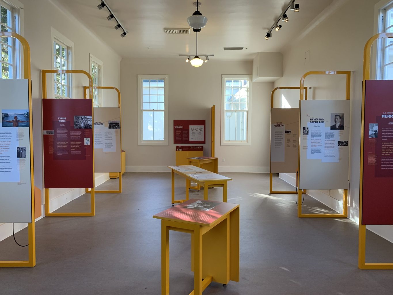 An exhibition of text and images on printed panels.