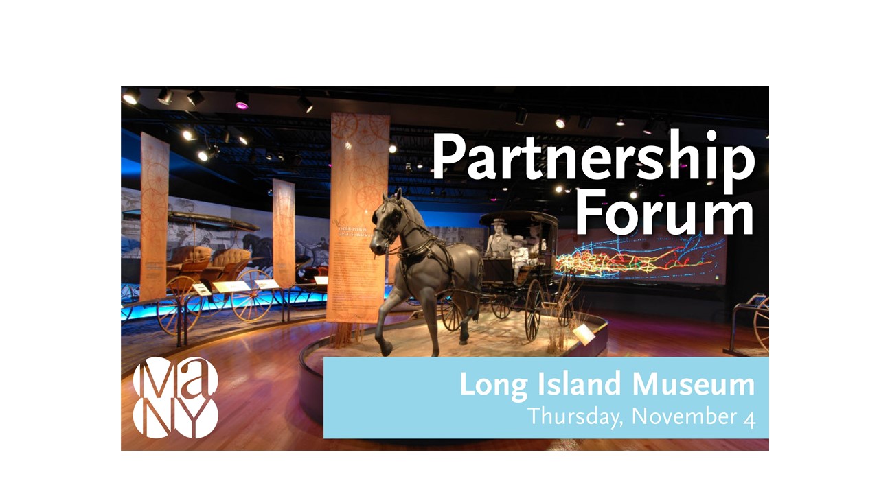 Interior gallery of Long Island Museum showing horse and carriage