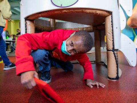 Second grade student from Butler Elementary School engaged in a scavenger hunt at the Kidzeum as part of the STEAM Residency Program, December 2021. Photo by Kari Bedford.