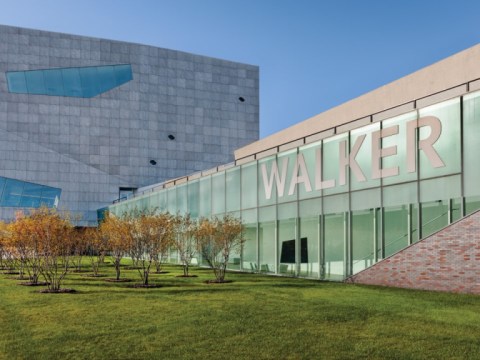 The exterior of a large building with a glass front that says Walker. 