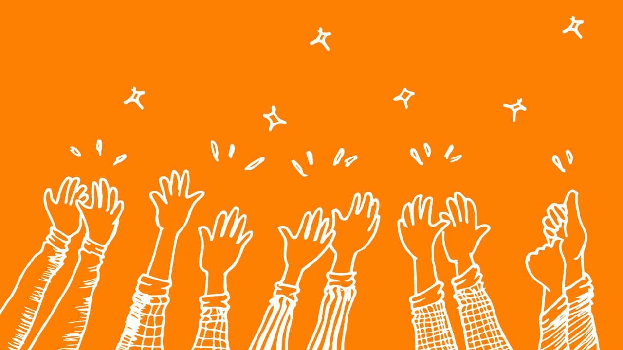An illustration of applauding hands on an orange background