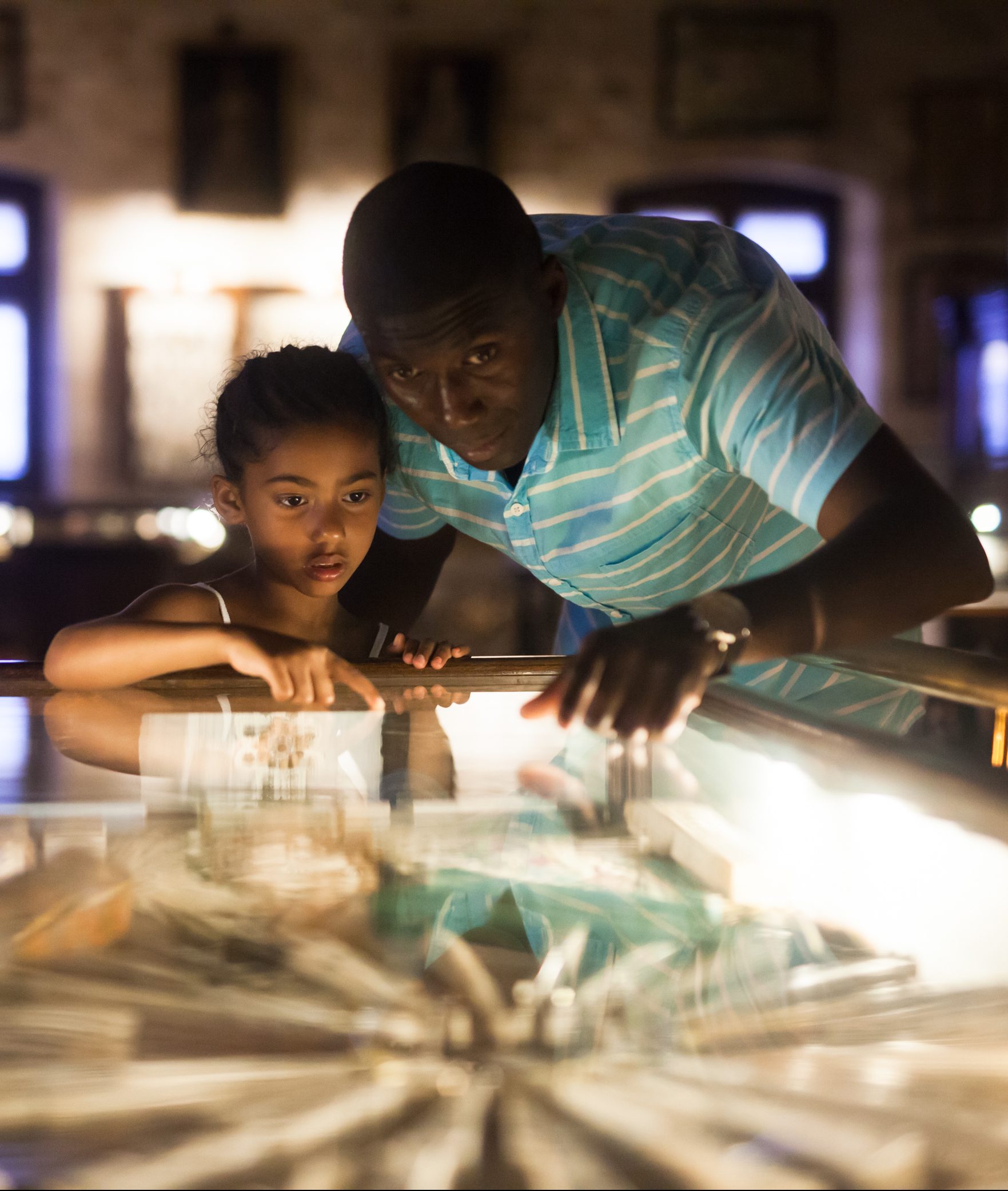 adult and child looking at an exhibit