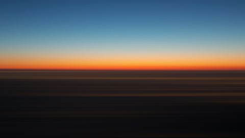 A thin orange line centers the horizon in the center.