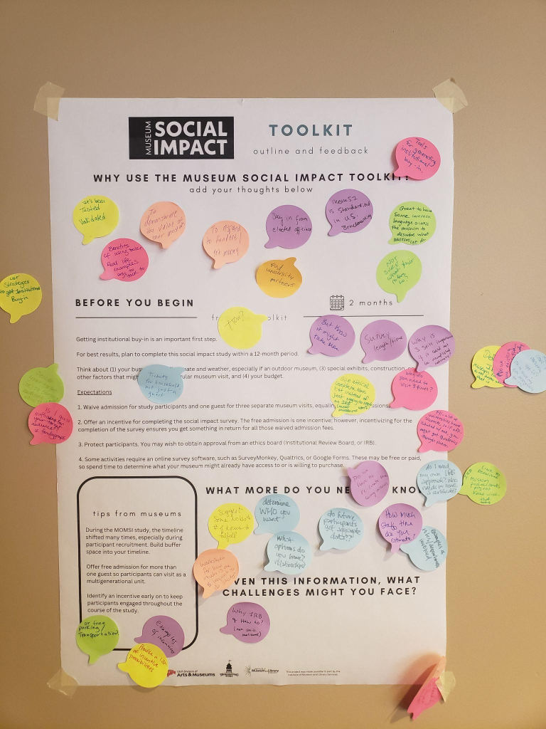A posterboard asking people to give their responses to why they would use the Museum Social Impact Toolkit