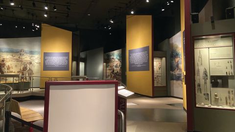 Several exhibit cases stand with lots of artifacts inside.