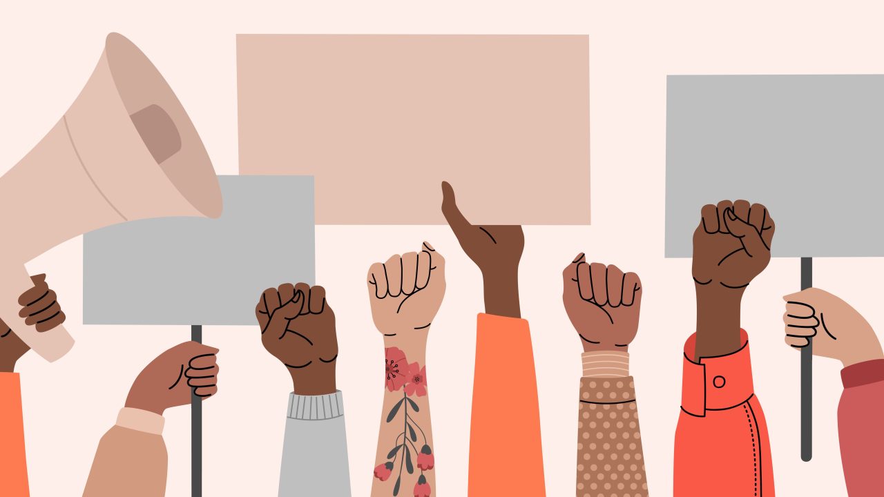 An illustration of hands holding blank protest signs and megaphones