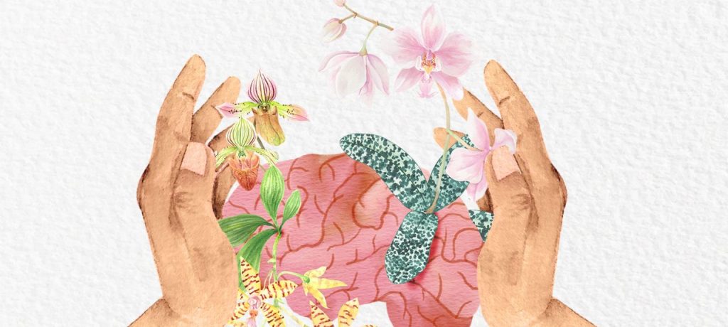An illustration of hands holding a brain with flowers growing from the folds