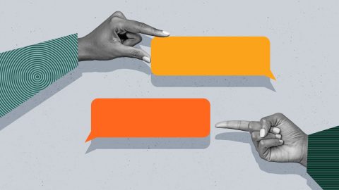 A graphic of two hands holding out speech bubbles to represent a text dialogue