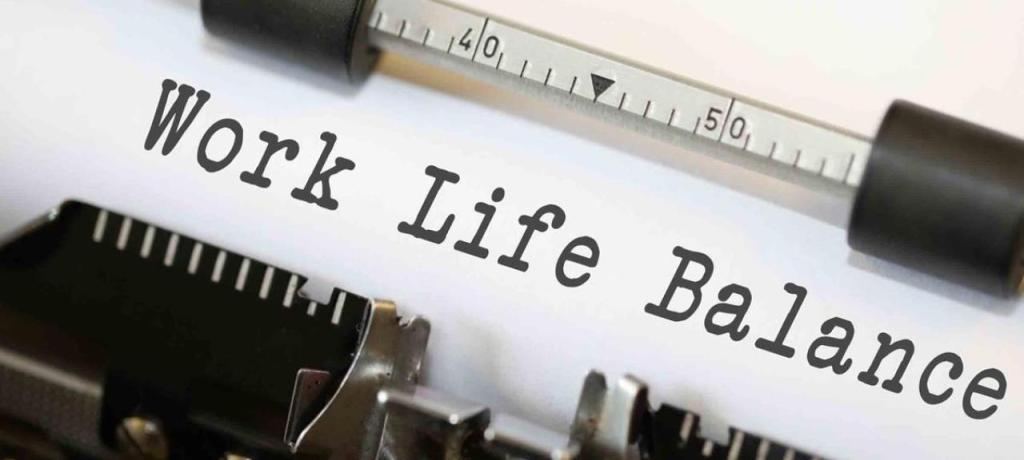 A typewriter with the words "work life balance" on the sheet