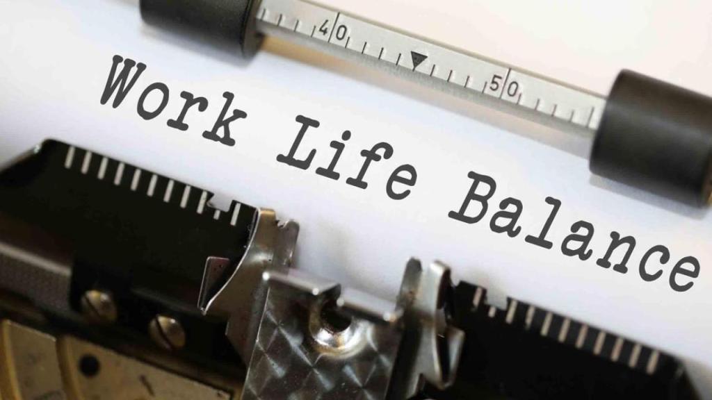 A typewriter with the words "work life balance" on the sheet
