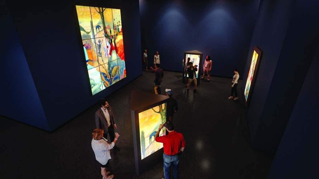 Several people in a darkened gallery with stained glass displays lit from behind. 