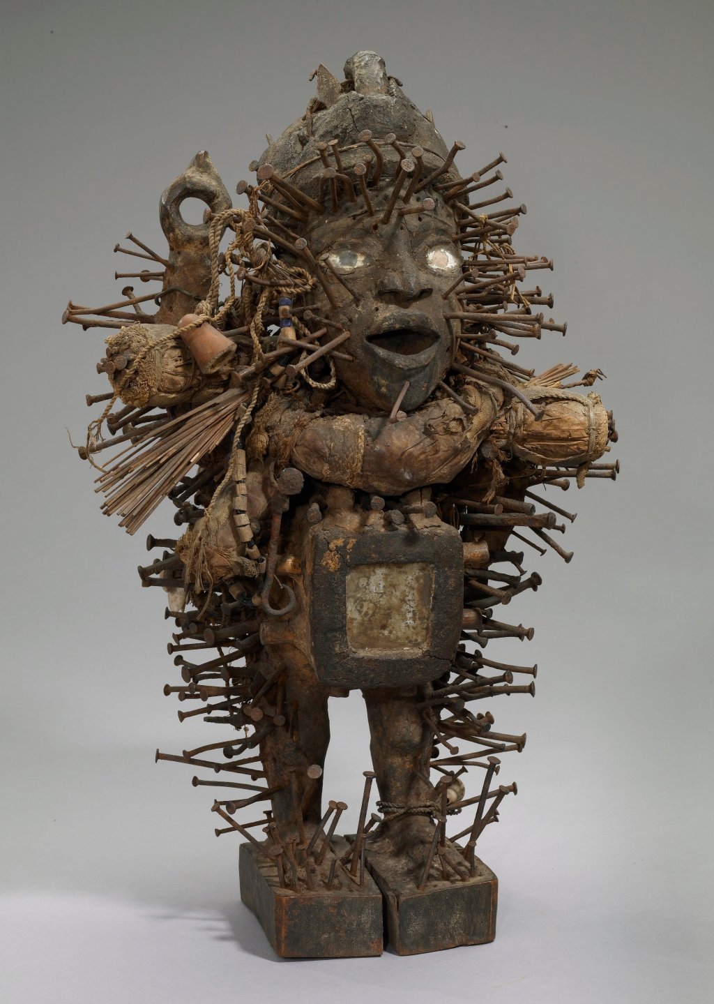A power figurine from Kongo, Africa constructed with wood, natural fibers, glass, metal, and other materials.