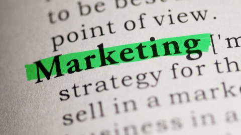 Dictionary entry for "Marketing" with the word highlighted in green.