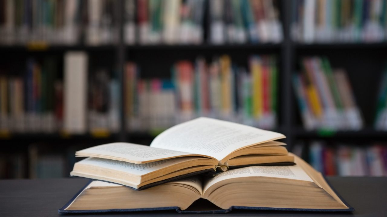 Close up of open books on table.