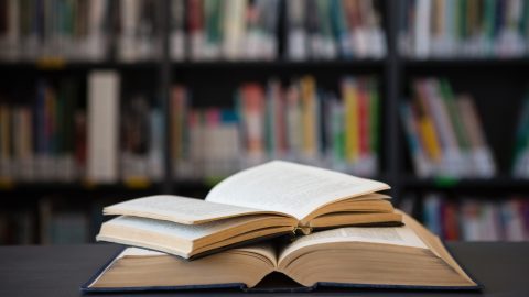 Close up of open books on table.
