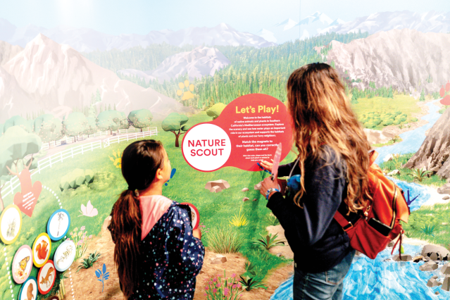 Visitors to the Ontario Museum of History & Art explore the habitat of native animals and plants in Southern California’s ecosystem at the Nature Scout wall in the “Built on Water” exhibition. Photo by Watchara Phomicinda.