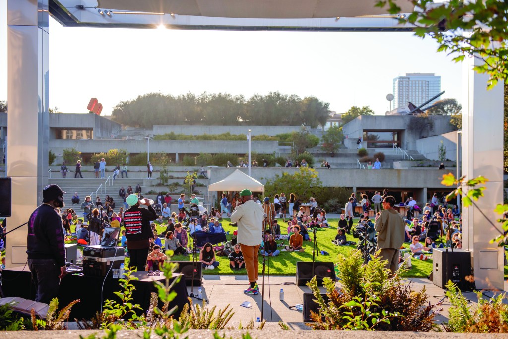 Crowds enjoy a live music performance at Oakland Museum of California's Friday Nights.