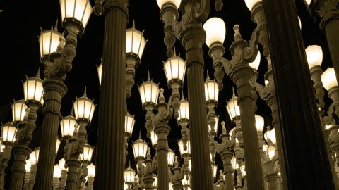 A huddle of street lamps shot from below