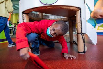 Second grade student from Butler Elementary School engaged in a scavenger hunt at the Kidzeum as part of the STEAM Residency Program, December 2021. Photo by Kari Bedford.