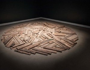 Drifwood is pieced together in the shape of a circle.