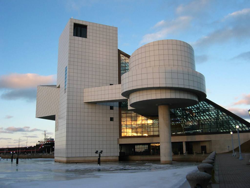 Facade of a modernist museum building at dusk.