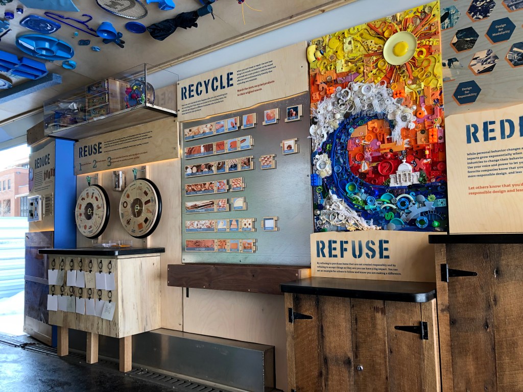 A gallery constructed out of salvaged wood and household objects