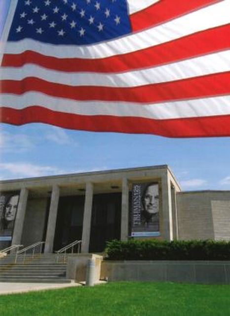 Image of the exterior of the museum with the American flag flying at the top of the image.