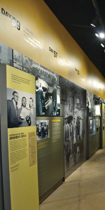 Exhibit image of images and text on a yellow wall .