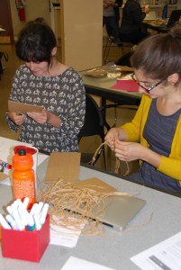 Two young women make a craft