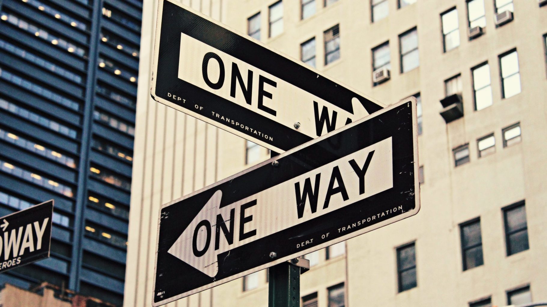 Intersection "one way" road signs.