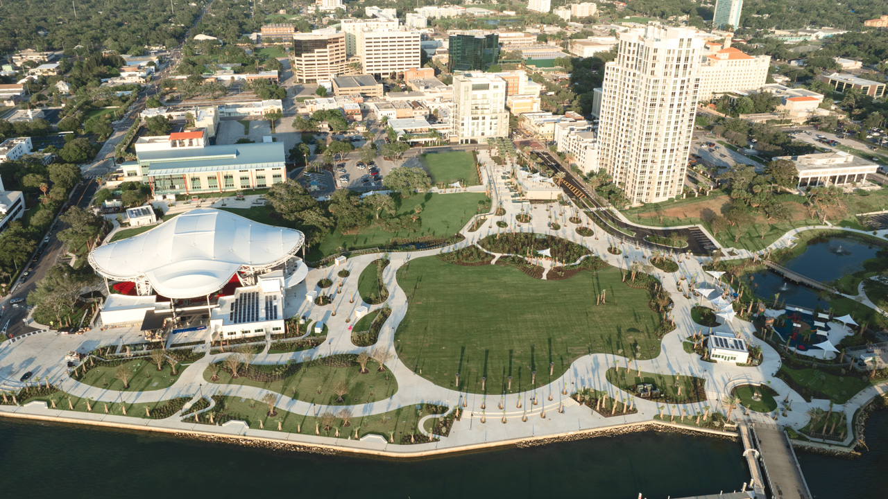 An aerial view of a city situated on a body of water