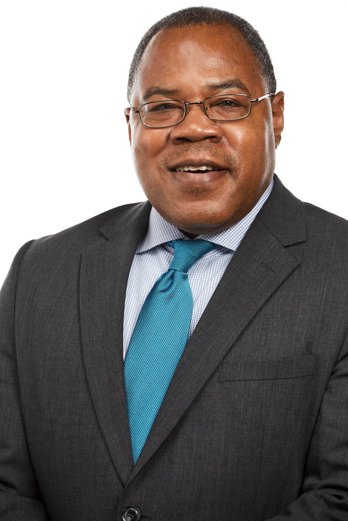 Photo of Le Monte Booker. He is wearing glasses with short black hair.