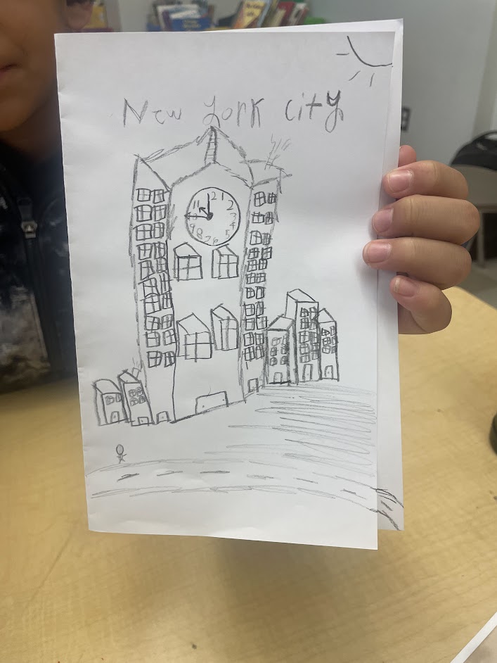 A student drawing of a building with the words "New York City" written above it