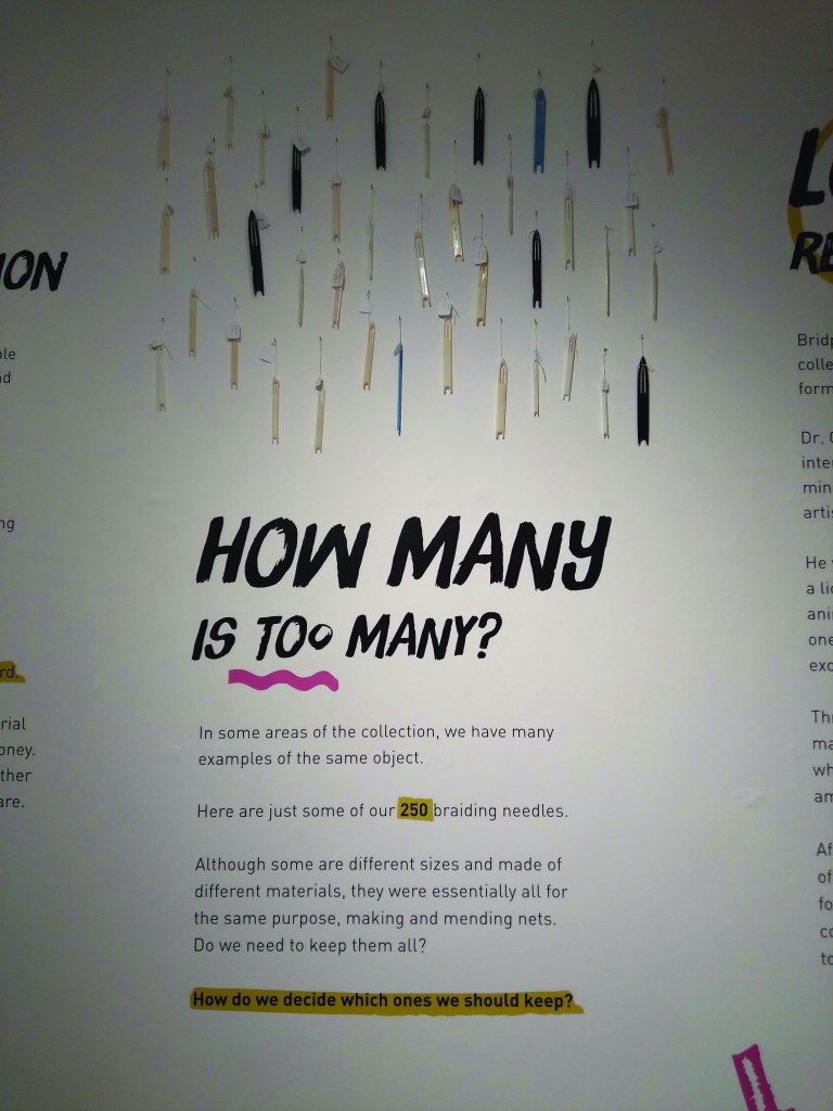 Exhibit display wall reads "How many is too many?"
