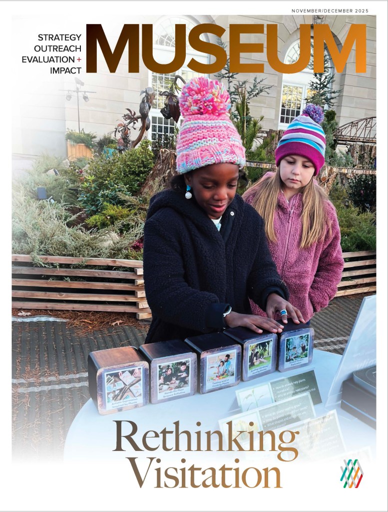 Magazine cover of issue titled "Rethinking Visitation" is a photo of two children outdoors interacting with educational objects on a table