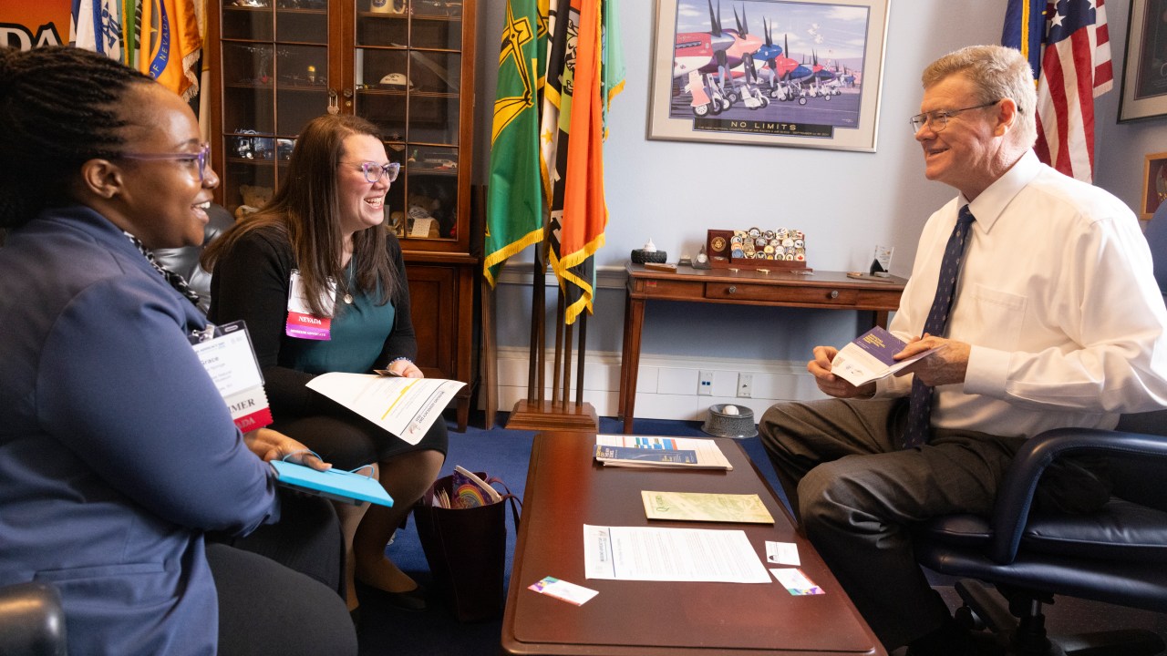 two people meeting with a member of Congress