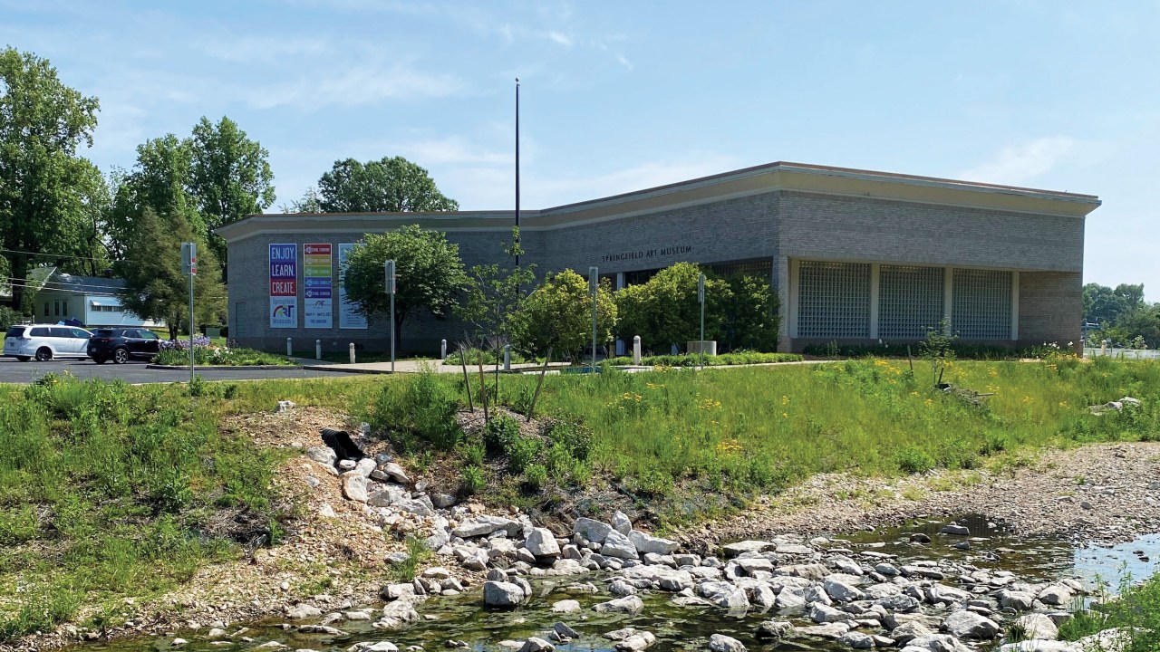 Museum building right next to a creek.