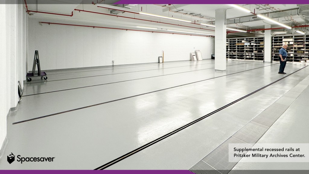 Interior of a collections storage area with modular shelving being installed.