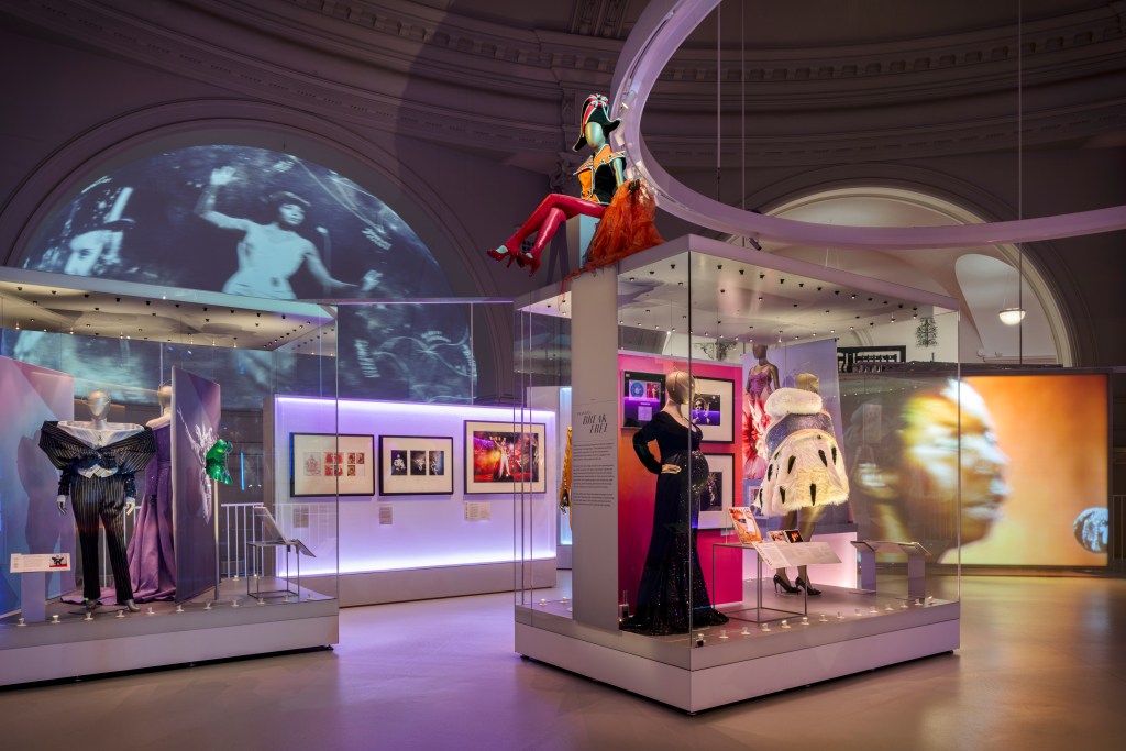 The top floor of the DIVA exhibition, including multiple mannequins with unique designs and poses, displaying garments belonging to the performers featured in the exhibition.