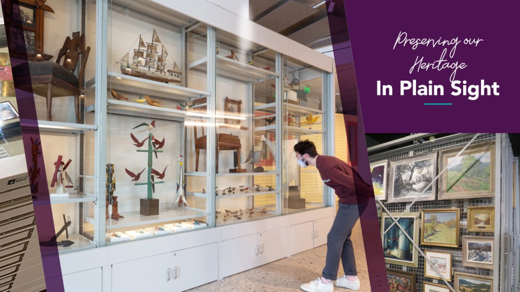 A person looking closely at a large visible storage cabinet with numerous objects on display and "Preserving our Heritage In Plain Sight" written over the top right corner.
