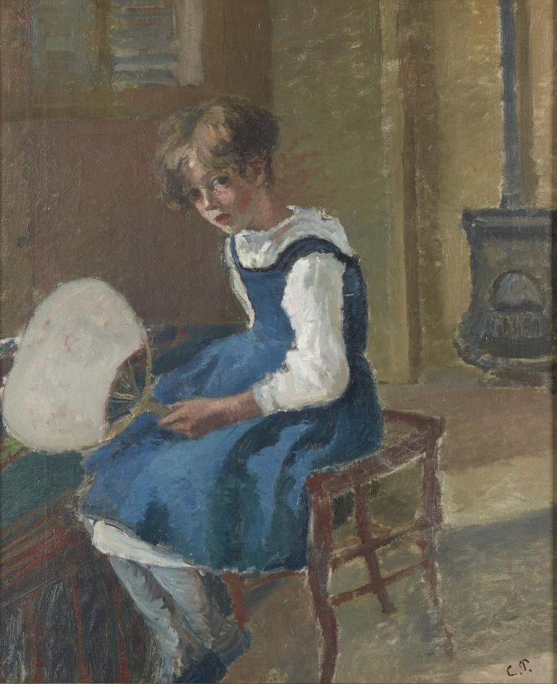 An Impressionist oil painting by Camille Pissarro depicting a young girl seated on a wooden chair in a warmly lit interior. She wears a blue pinafore over a white long-sleeved shirt and holds a white fan in her left hand. She glances toward the viewer. A dark cast-iron stove is visible in the background to the right. The artistโs initials, C.P., are in the lower right corner.